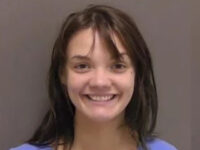 Fargo Woman Smiles for the Camera After Allegedly Hacking Boyfriend with Hatchet