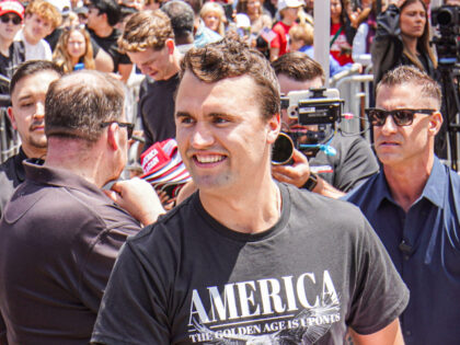 Charlie Kirk, founder of Turning Point USA, throws hats to the public. Turning Point USA f