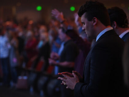 Turning Point USA founder Charlie Kirk prays as he attends Freedom Night In America at Dre