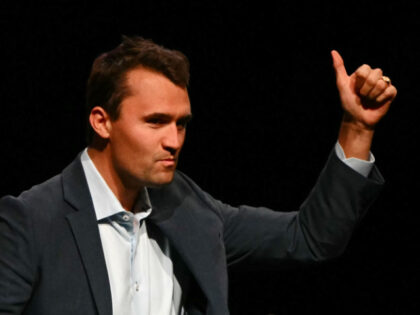 US political activist Charlie Kirk gives a thumbs up as he speaks before a live interview