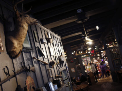 A deer head hangs above a hearth inside a Cracker Barrel Old Country Store Inc. restaurant