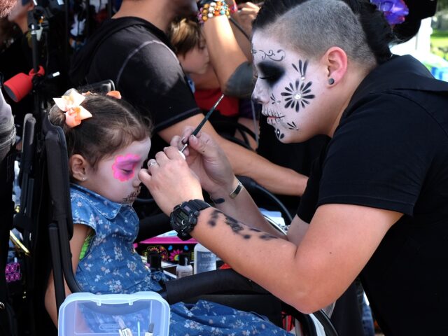 Dia de los Muertos (Richard Vogel / Associated Press) Three and half year-old Valencia Elena, from Long Beach, Calif. has her make-up done prior