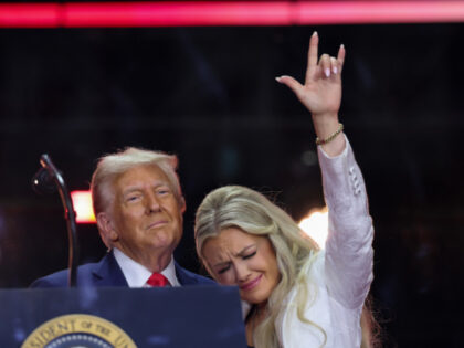 Erika Kirk joins U.S. President Donald Trump onstage during the memorial service for polit