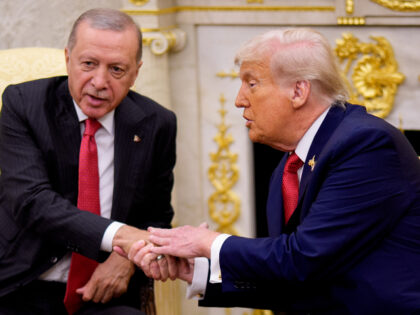U.S. President Donald Trump (R) shakes hands with President of Turkey Recep Tayyip Erdogan