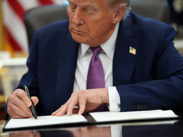 Donald Trump signs executive order U.S. President Donald Trump signs executive orders during a press availability in the Oval
