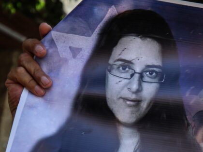 Members of the Palestinian Prisoners Committee hold a rally outside the International Comm