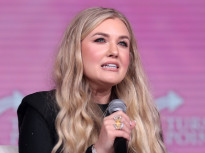 Erika Kirk speaking with attendees at the 2023 Young Women's Leadership Summit hosted by T