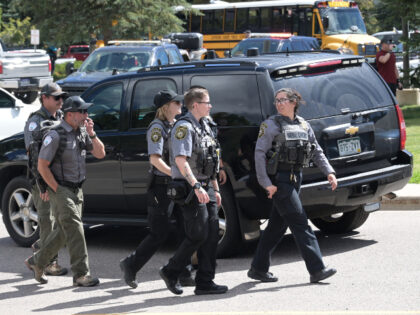 Law enforcement officers respond to a shooting at Evergreen High School in Evergreen, Colo