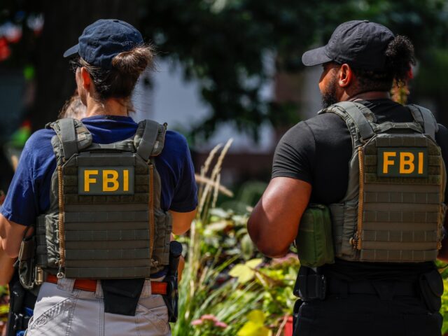 FBI makes arrest WASHINGTON, D.C., UNITED STATES - SEPTEMBER 15: An FBI agent and a Metropolitan Police Dep