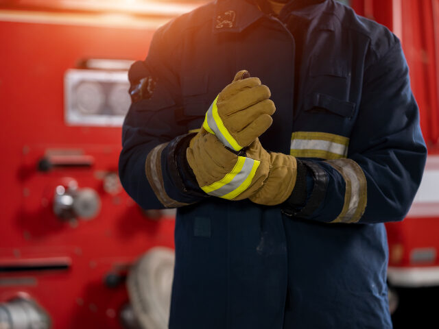 Fireman with gas mask and helmet at fire station,Firefighters intervening in a pernicious