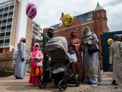 LONDON, ENGLAND - MAY 02: A family gathers outside the East London Mosque after morning pr