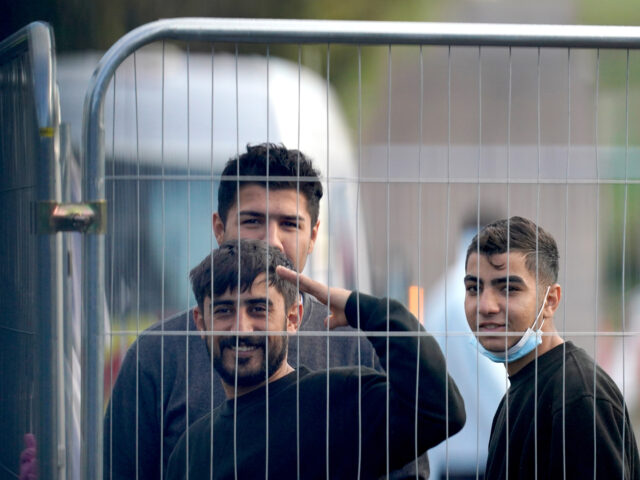 People thought to be migrants inside the Manston immigration short-term holding facility l
