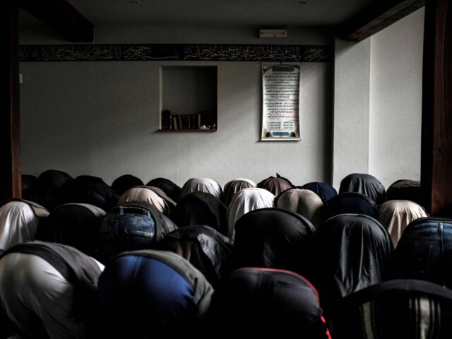 TO GO WITH AFP STORY BY PAULINE TALAGRAND Pupils pray in a mosque, on October 16, 2012, at