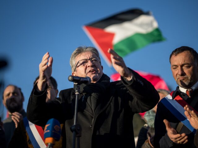 French Founder of La France Insoumise (LFI) party Jean-Luc Melenchon (C) gestures as he ad