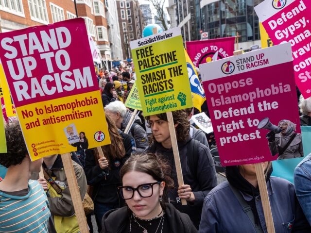 Anti-racism activists attend a Stop Islamophobia Stop The Hate rally outside the Home Offi