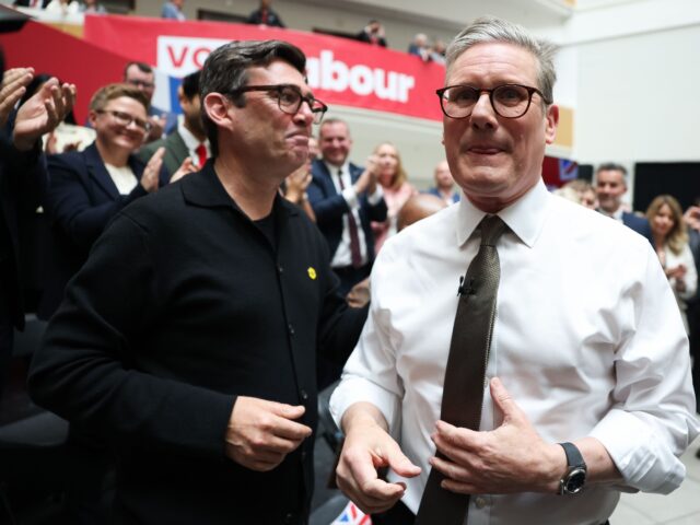 Keir Starmer, leader of the Labour Party, right, and Andy Burnham, mayor of Manchester, du