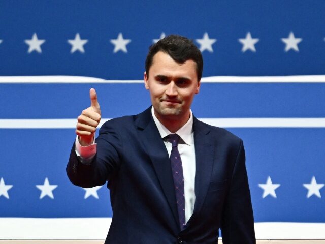 US media personality Charlie Kirk gives a thumbs up as he arrives to speak during the pres