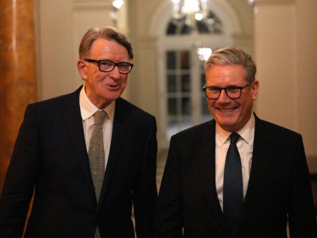 WASHINGTON, DC - FEBRUARY 26: British Prime Minister Keir Starmer (R) talks with Britain's