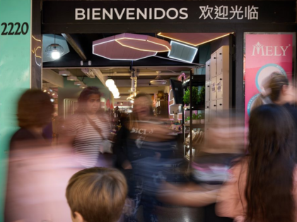 People walk past a Chinese supermarket in the Chinatown in Buenos Aires, Argentina, May 10