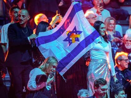 15 May 2025, Switzerland, Basel: Music fans of the contestant from Israel stand with the I
