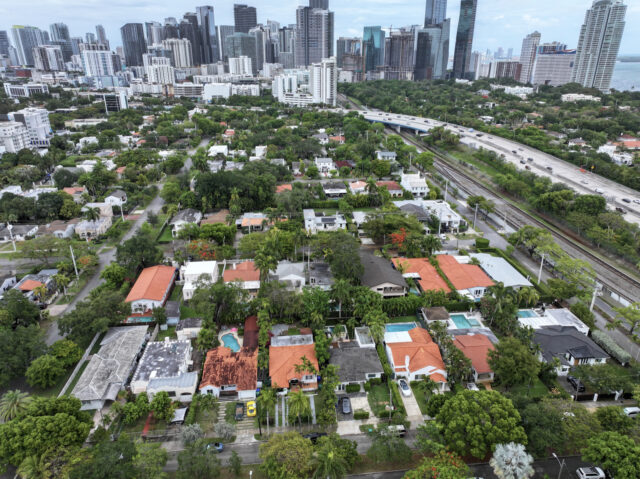 MIAMI, FLORIDA - MAY 12: In an aerial view, a residential neighborhood is close to the Ci
