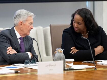Chairman of the US Federal Reserve Jerome Powell speaks with Lisa Cook, member of the Boar
