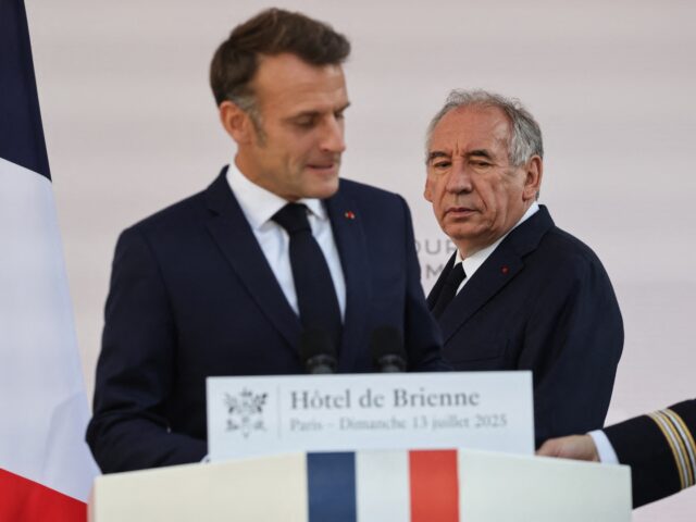 France's Prime Minister Francois Bayrou (R) arrives to hear France's President Emmanuel Ma