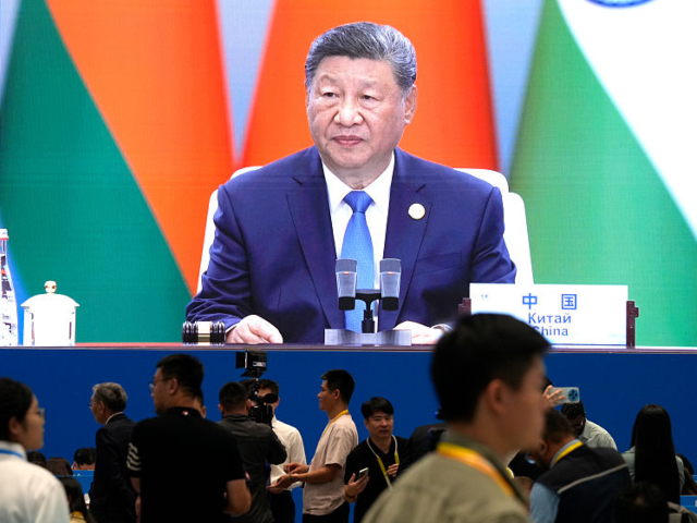 GettyImages-2232574445 Xi Jinping, China's president, displayed on a screen at the media center for the Shanghai