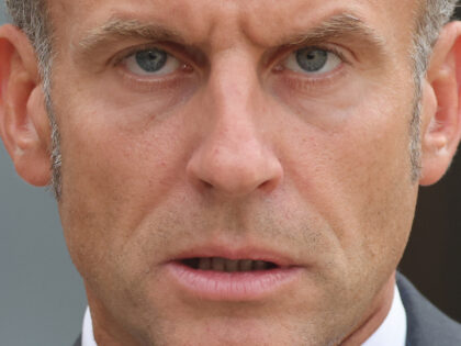 France's President Emmanuel Macron reacts as he greets Ukraine's President prior to their