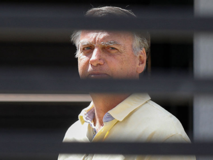 Former Brazilian President Jair Bolsonaro gestures from his residence in Brasilia on Septe