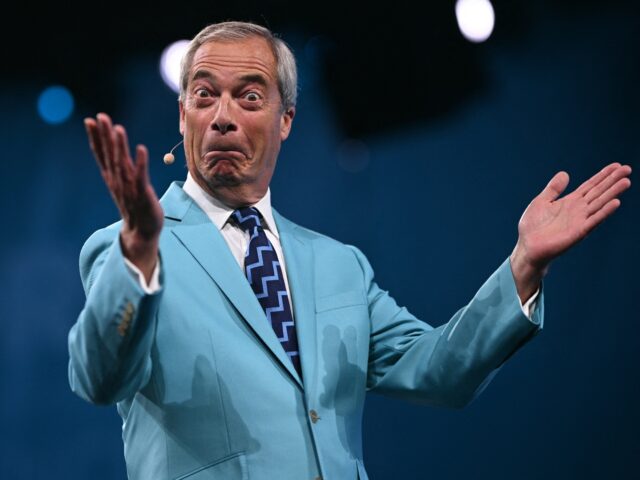 TOPSHOT - Reform UK Leader Nigel Farage reacts while performing on the first day of the Re