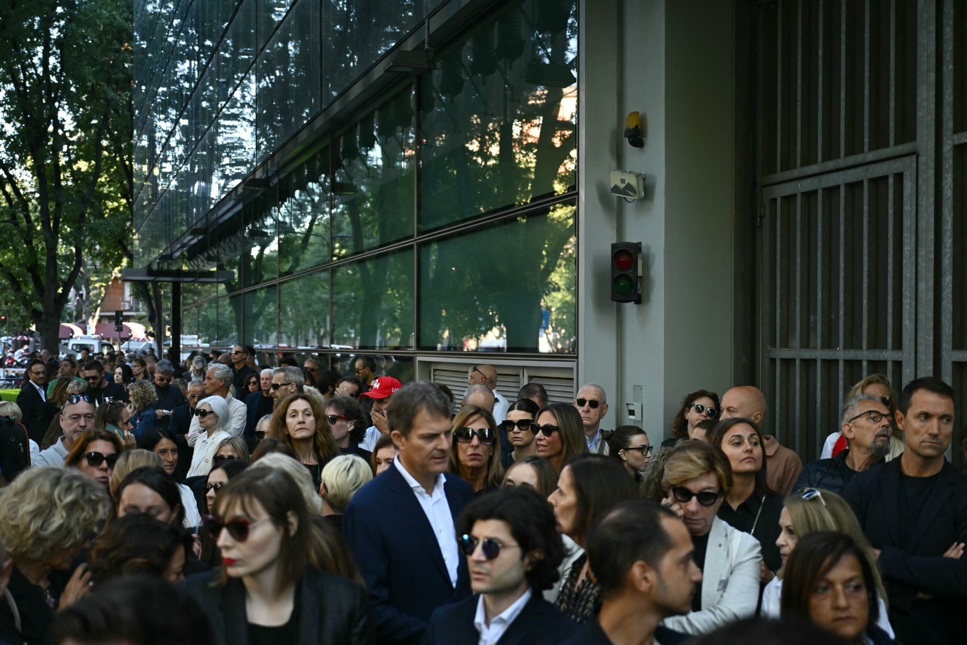People queue to pay their respects to late Italian fashion designer Giorgio Armani lying-in state for two days at the Armani Theatre in Milan, on September 6, 2025. Giorgio Armani died on September 4, 2025 at 91. (Photo by Stefano RELLANDINI / AFP) (Photo by STEFANO RELLANDINI/AFP via Getty Images)