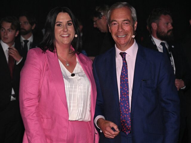 Reform UK Leader Nigel Farage smiles with Lucy Connolly on the second and final day of the