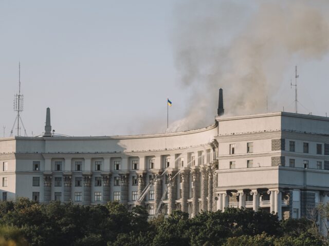 Smoke rises from a fire at the Cabinet of Ministers building after a Russian air strike in