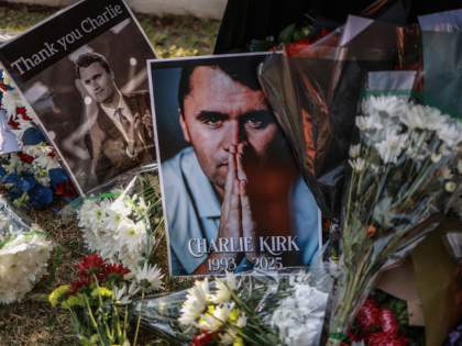 TOPSHOT - A general view of a wreath laid by mourners outside the US Embassy in Pretoria o