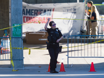 OREM, UTAH - SEPTEMBER 11: Police officers and FBI agents walk through the courtyard at Ut