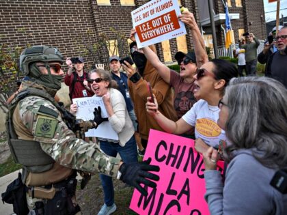 BROADVIEW, ILLINOIS - SEPTEMBER 12: Demonstrators protest yell as they taunt ICE agents ou