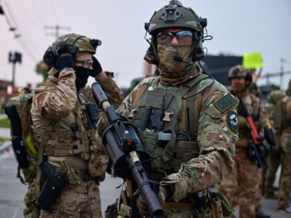 Federal agents violently confront protesters gathered outside of the suburban Chicago ICE