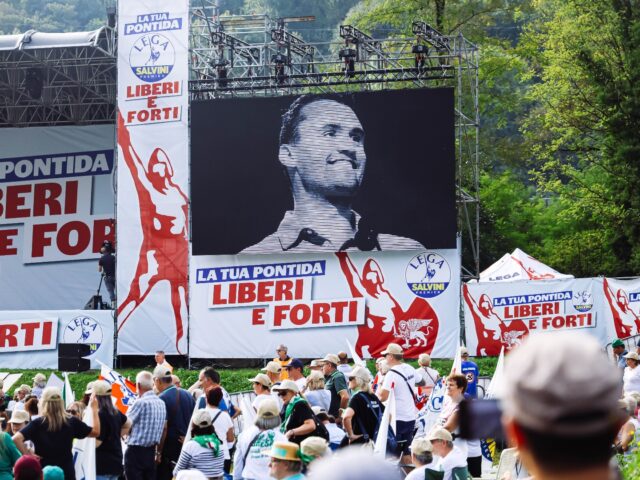 Supporters observe a minute of silence in memory of Charlie Kirk at the annual rally of th
