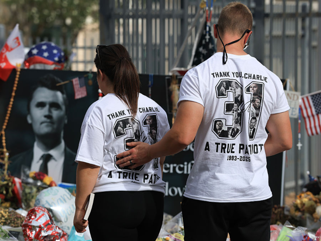 PHOENIX, ARIZONA - SEPTEMBER 18: People visit the makeshift memorial for Charlie Kirk outs