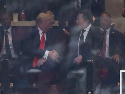 US President Donald Trump and Tesla CEO Elon Musk shake hands during the public memorial s