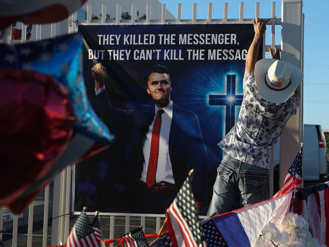 GettyImages-2236350102 PHOENIX, ARIZONA - SEPTEMBER 19: Dr. T Tran places a poster up in the makeshift memorial f