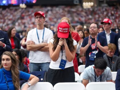 GLENDALE, ARIZONA - SEPTEMBER 21: Attendees watch the memorial service for political activ