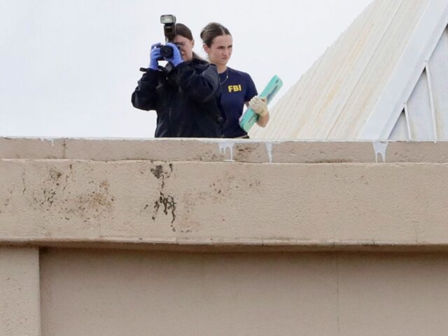 DALLAS, TEXAS - SEPTEMBER 24: Members of the FBI investigate from the rooftop at 1120 Empi