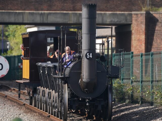 Train driver Chris Cubit rides on a replica of Locomotion No 1 during a test run for 'The