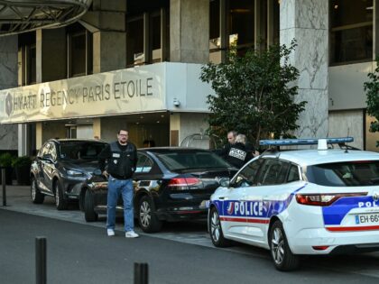 Members of the Judiciary Police arrive at the Hyatt Regency Paris Etoile Hotel at Porte Ma