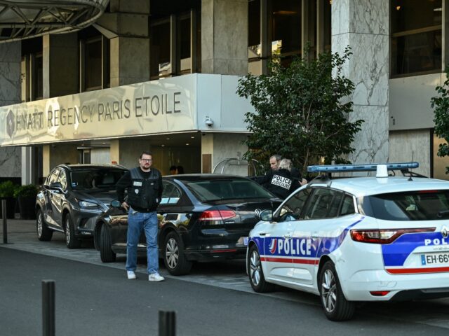 Members of the Judiciary Police arrive at the Hyatt Regency Paris Etoile Hotel at Porte Ma