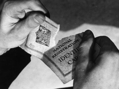 Tearing up a National Registration Identity Card. The cards, introduced in 1939, were abol