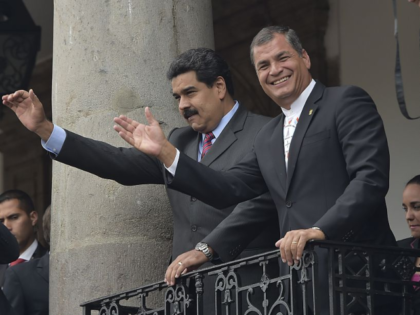 Venezuela's President Nicolas Maduro (L) and Ecuador's Rafael Correa greet the crowd from