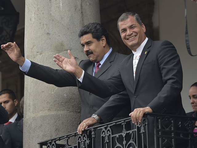 Venezuela's President Nicolas Maduro (L) and Ecuador's Rafael Correa greet the crowd from